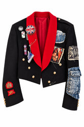 Black & Red Velvet Jacket featuring black velvet fabric, bold red shawl collar, gold buttons, denim patches, and eclectic pins and embellishments.